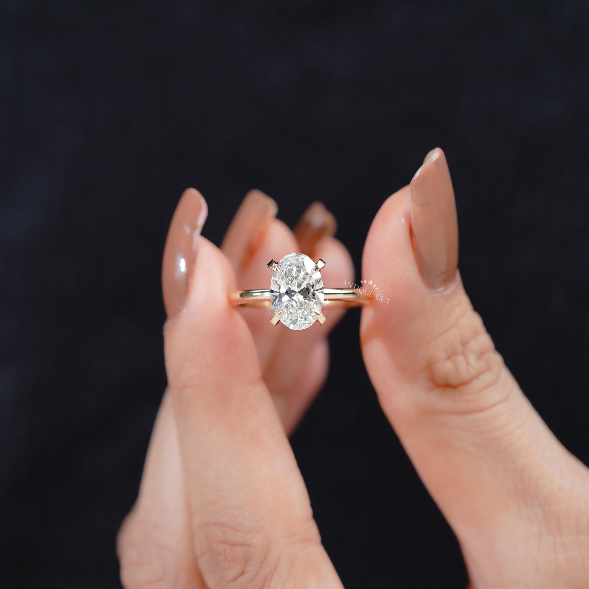 Oval solitaire ring with hidden halo detail