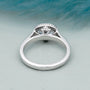 White gold oval diamond ring with hidden halo
