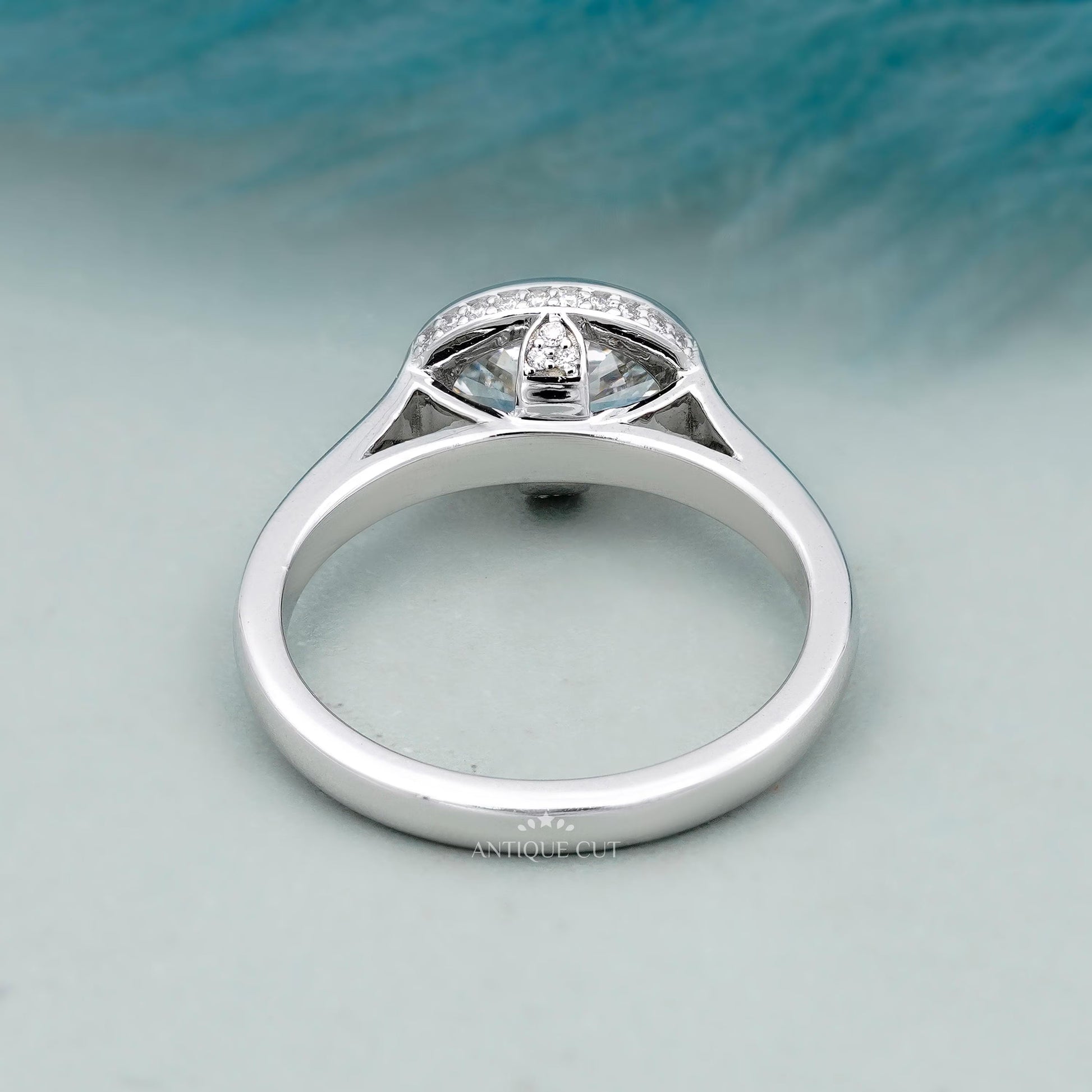 White gold oval diamond ring with hidden halo