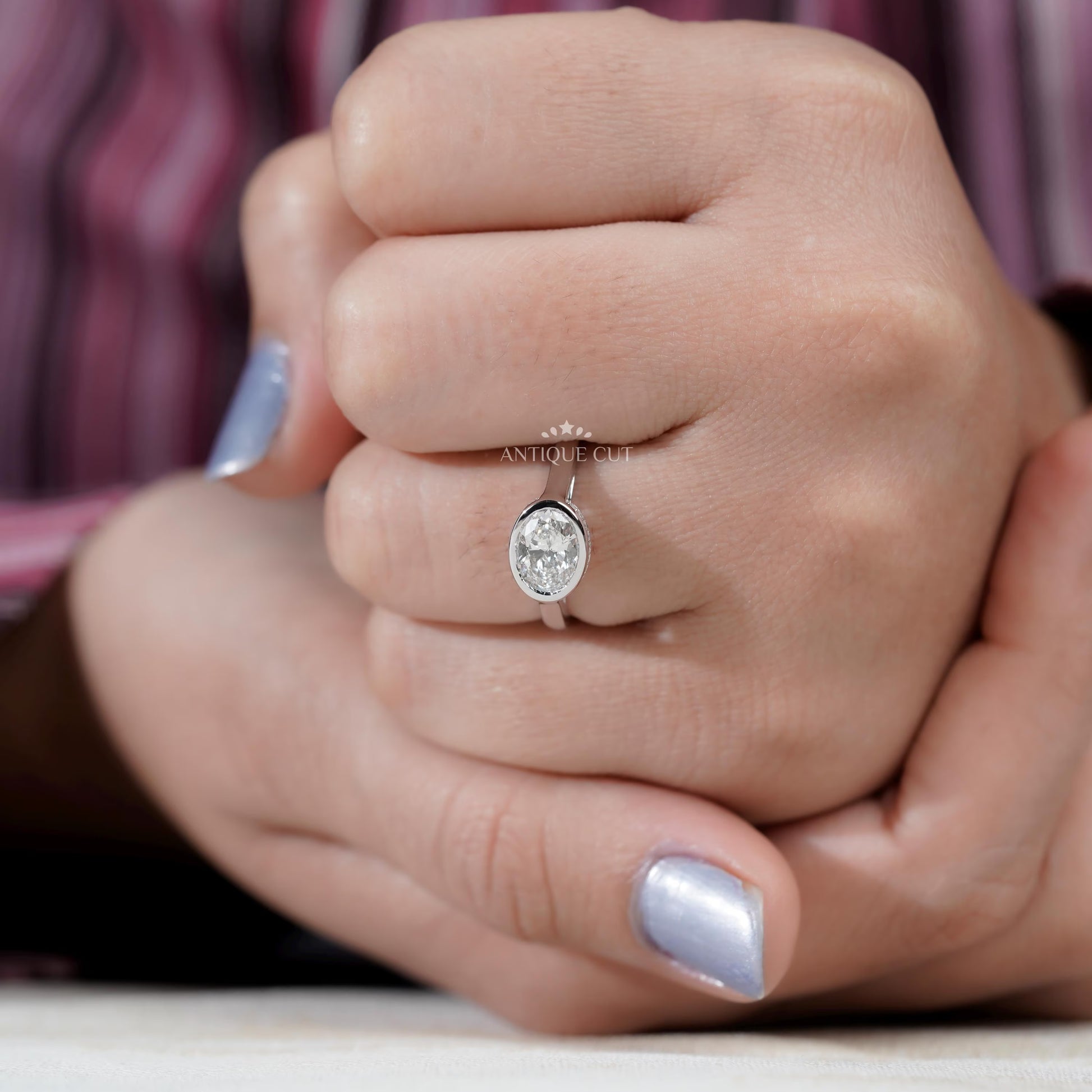 Oval lab grown diamond engagement ring with halo