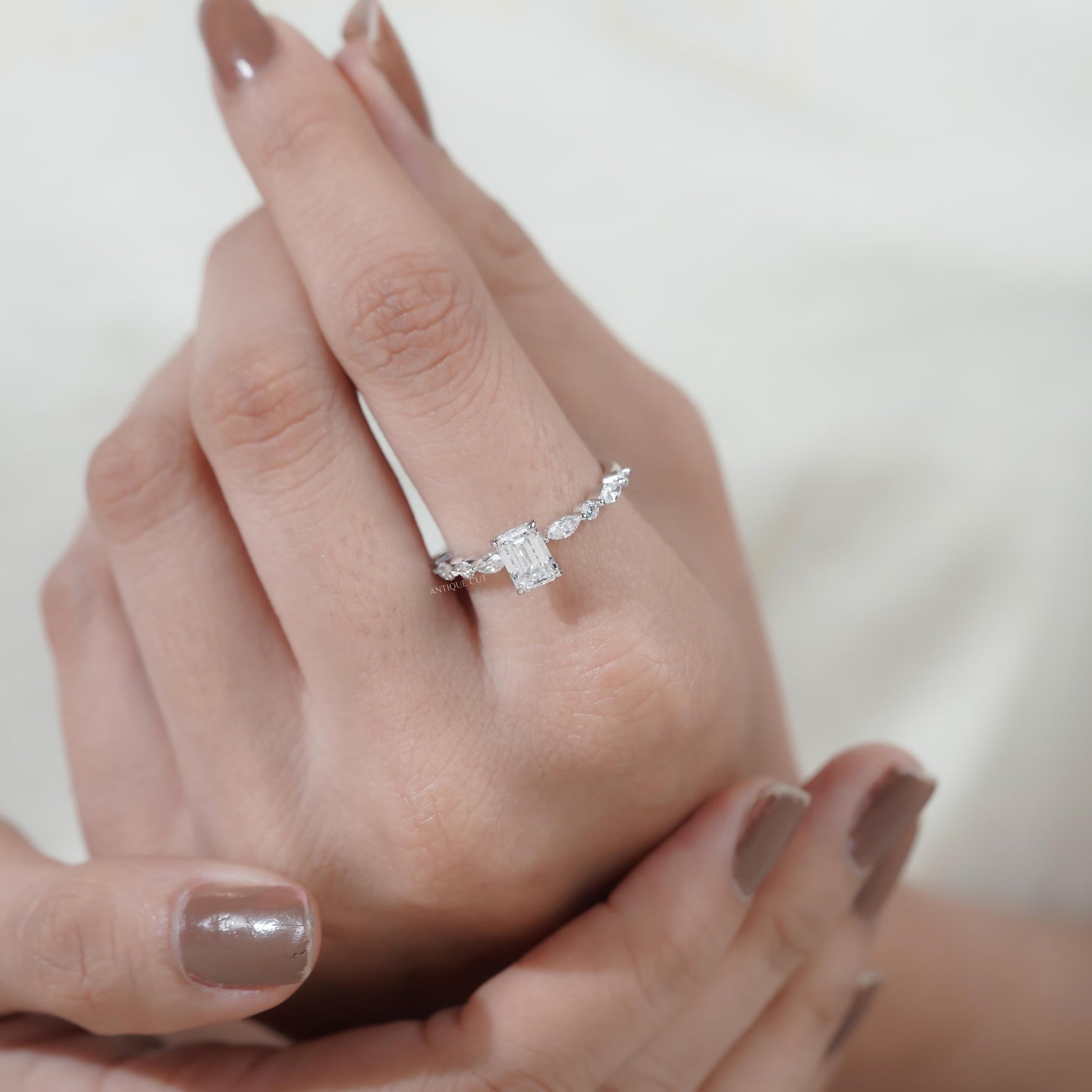 Premium emerald cut diamond ring with pave setting
