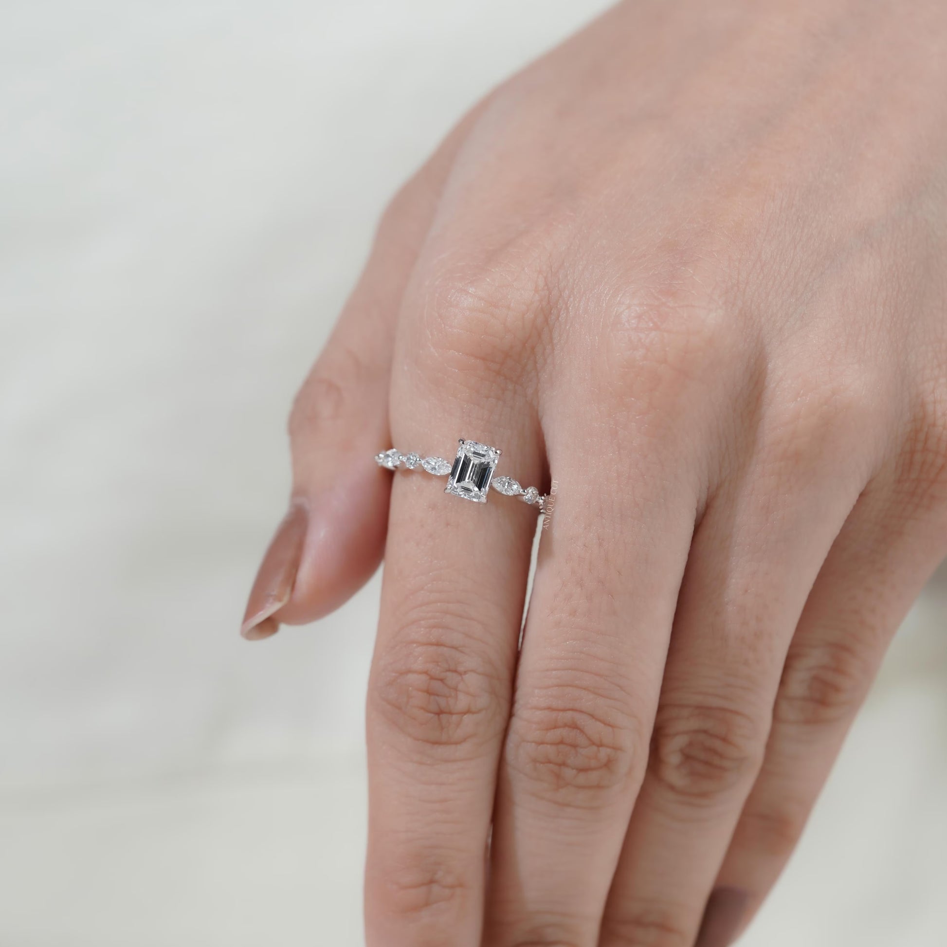 Modern white gold emerald cut engagement ring
