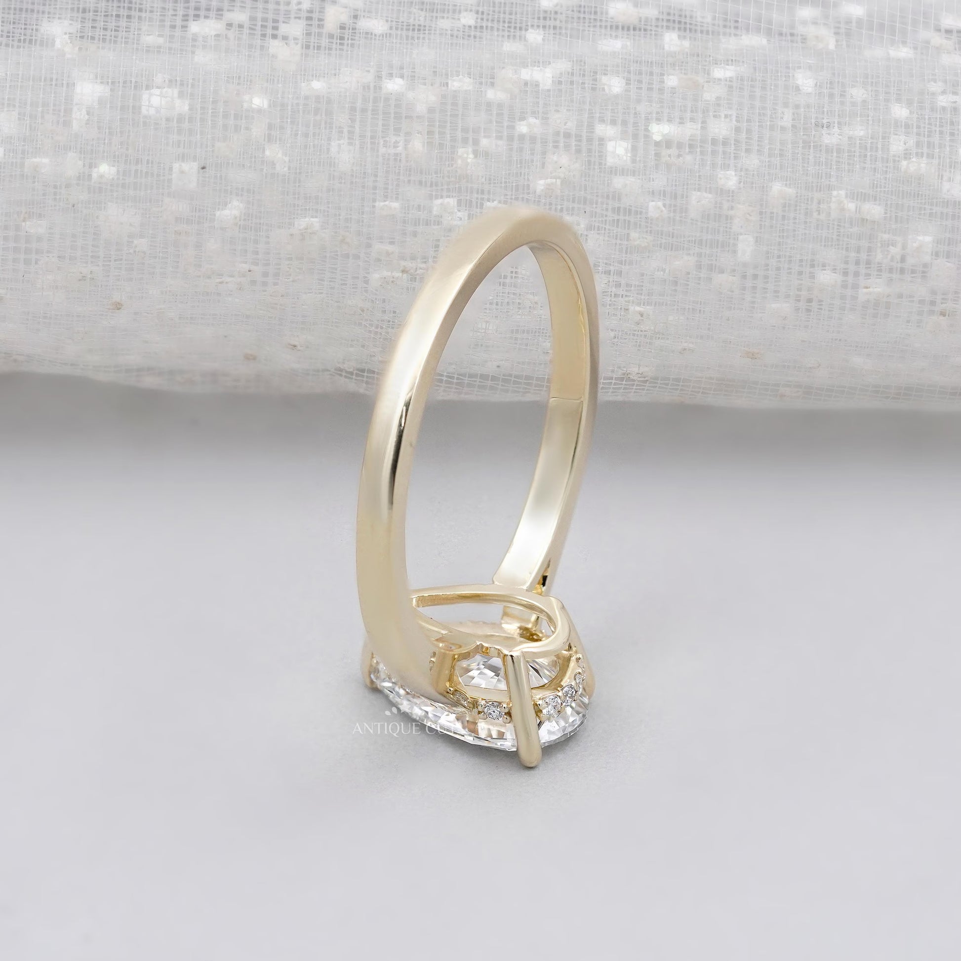 Elegant pear solitaire engagement ring
