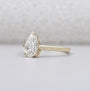 Solitaire diamond pear ring with hidden halo