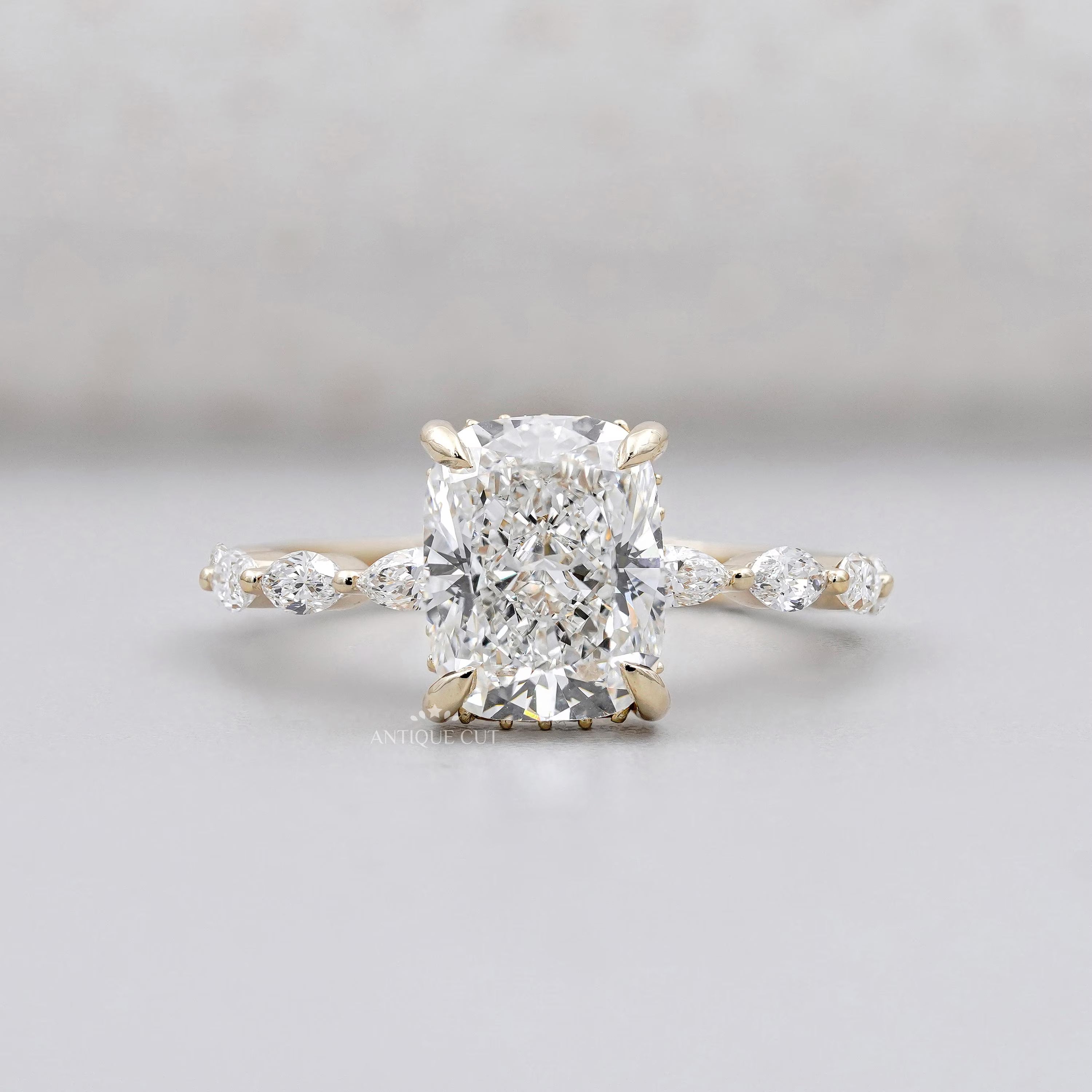 Cushion cut diamond ring with hidden halo