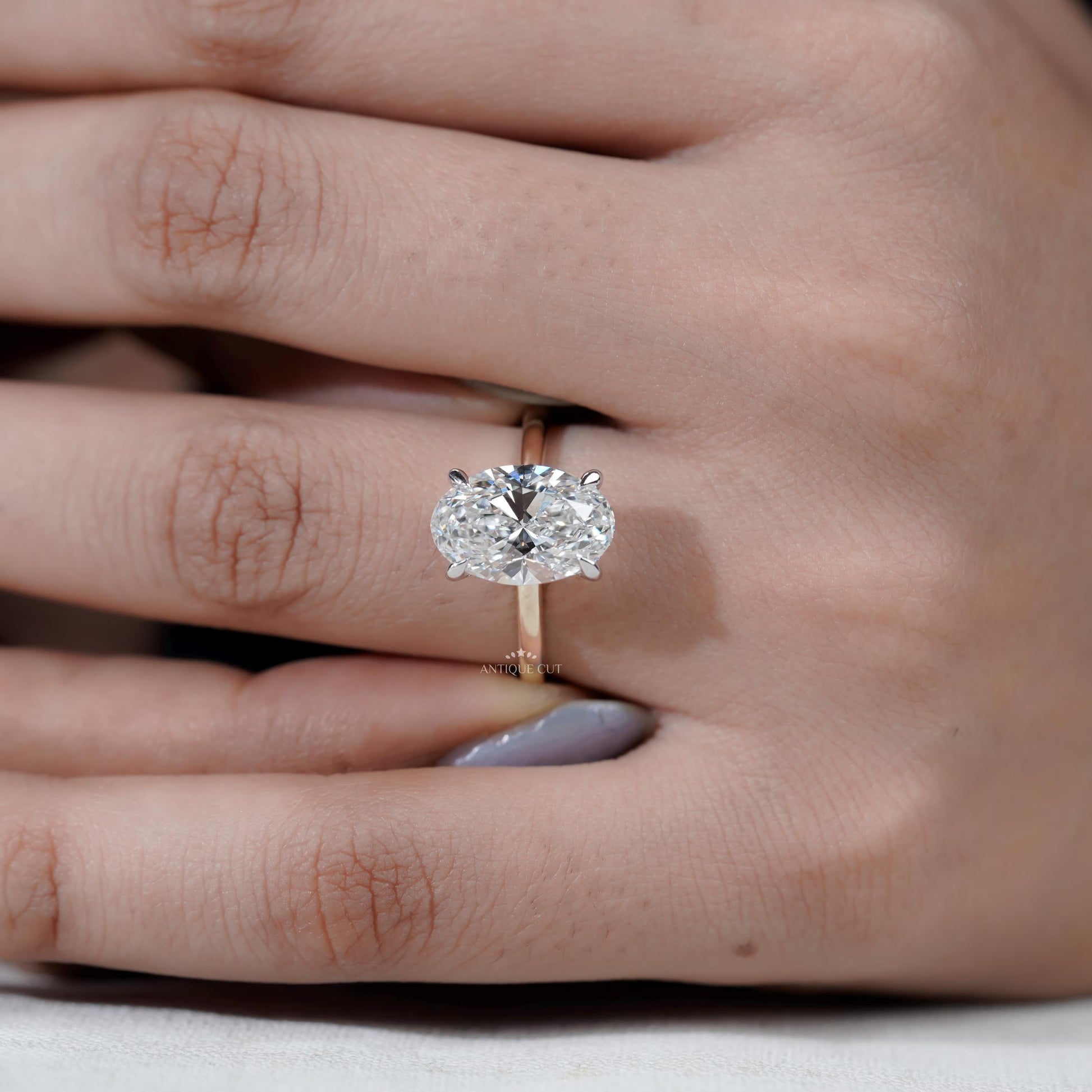 Modern oval hidden halo ring design