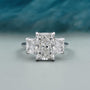 Radiant cut diamond three stone engagement ring