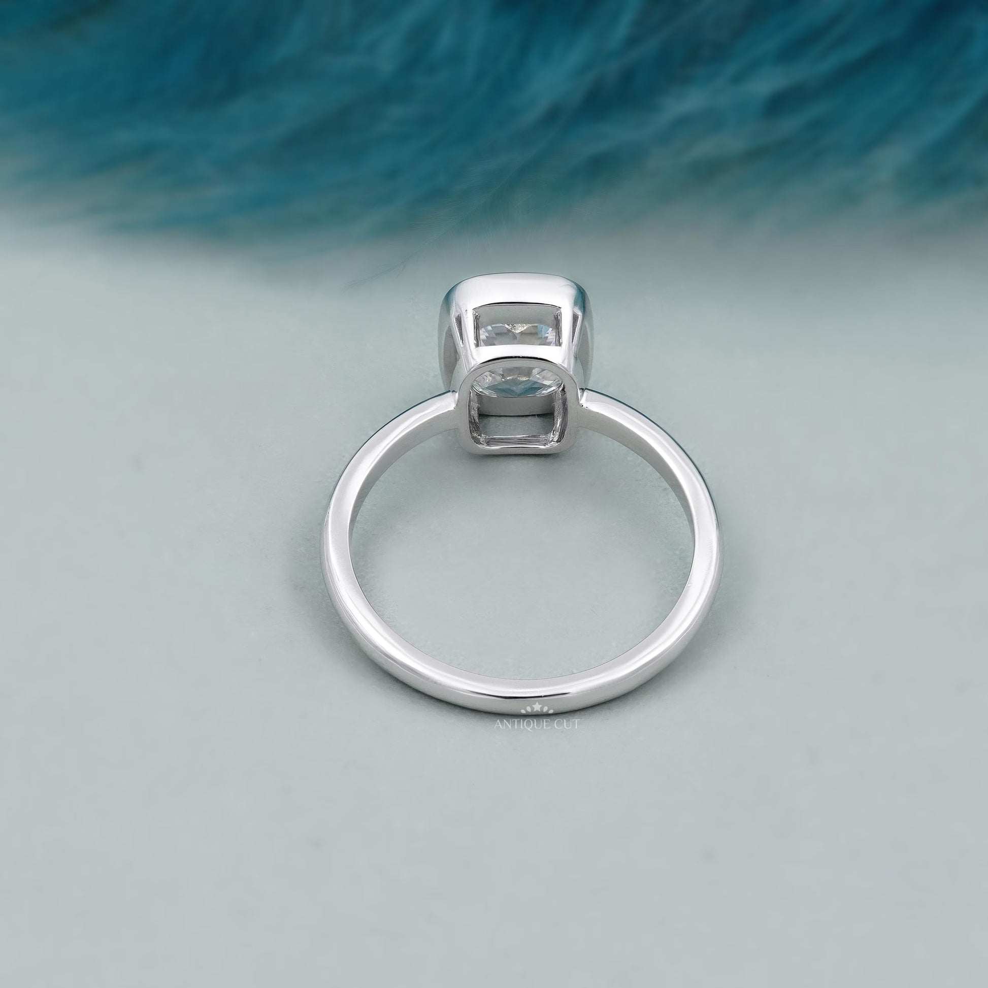 Cushion diamond ring with smooth bezel setting