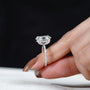 Modern oval diamond ring with pave band
