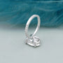 Oval diamond ring with sparkling pave band