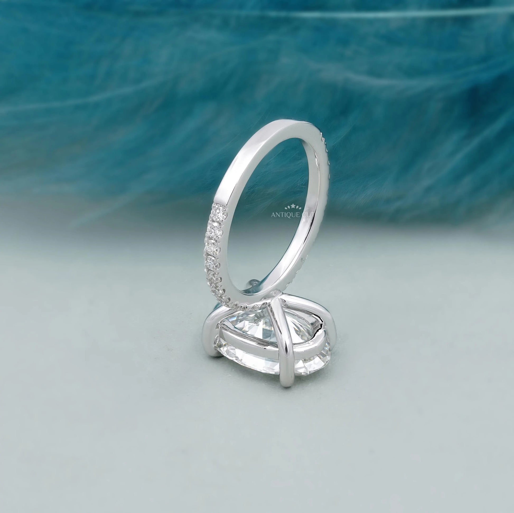 Oval diamond ring with sparkling pave band