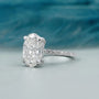 Pave diamond band oval engagement ring