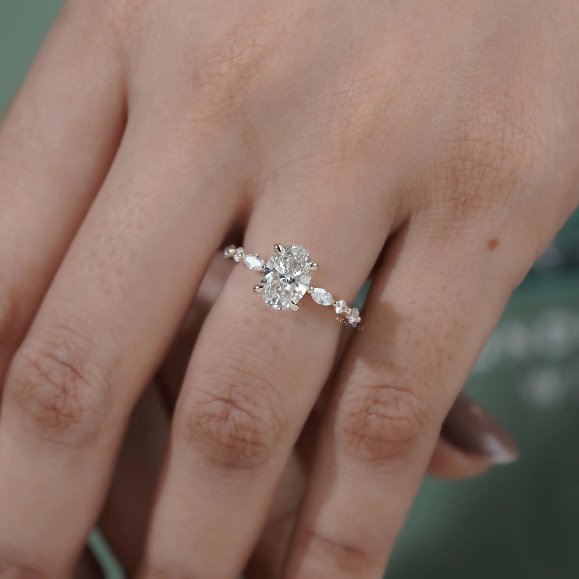 Marquise accent oval engagement ring