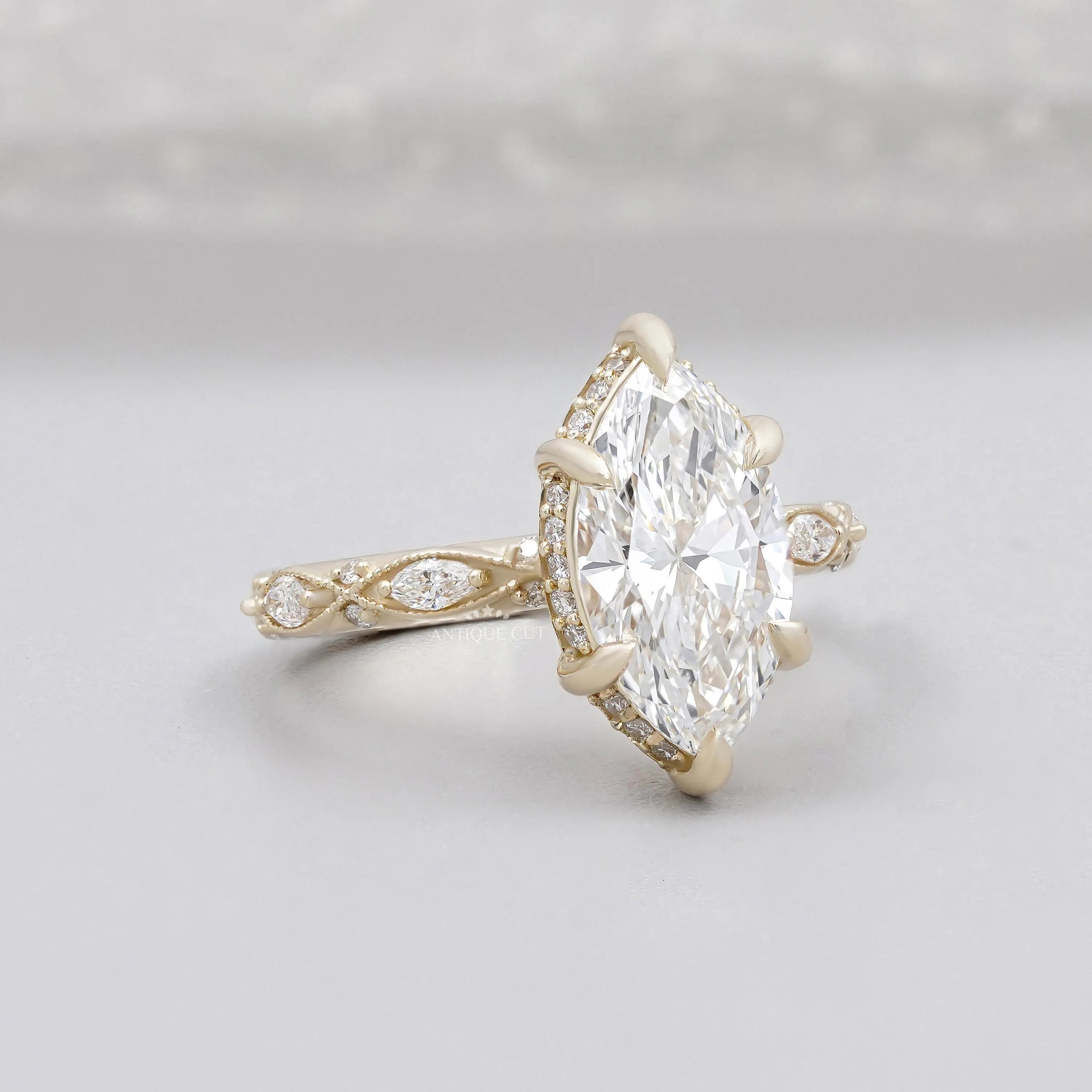 Marquise cut diamond engagement ring with vintage yellow gold band