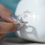 Marquise solitaire diamond ring with detailed gold band