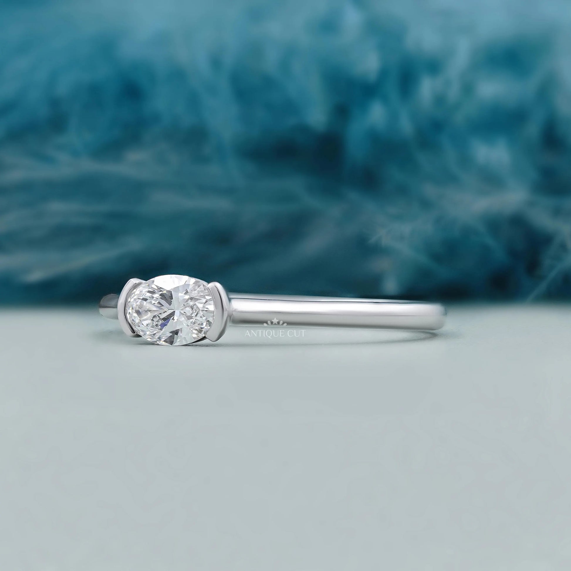 Horizontal oval cut diamond solitaire engagement ring