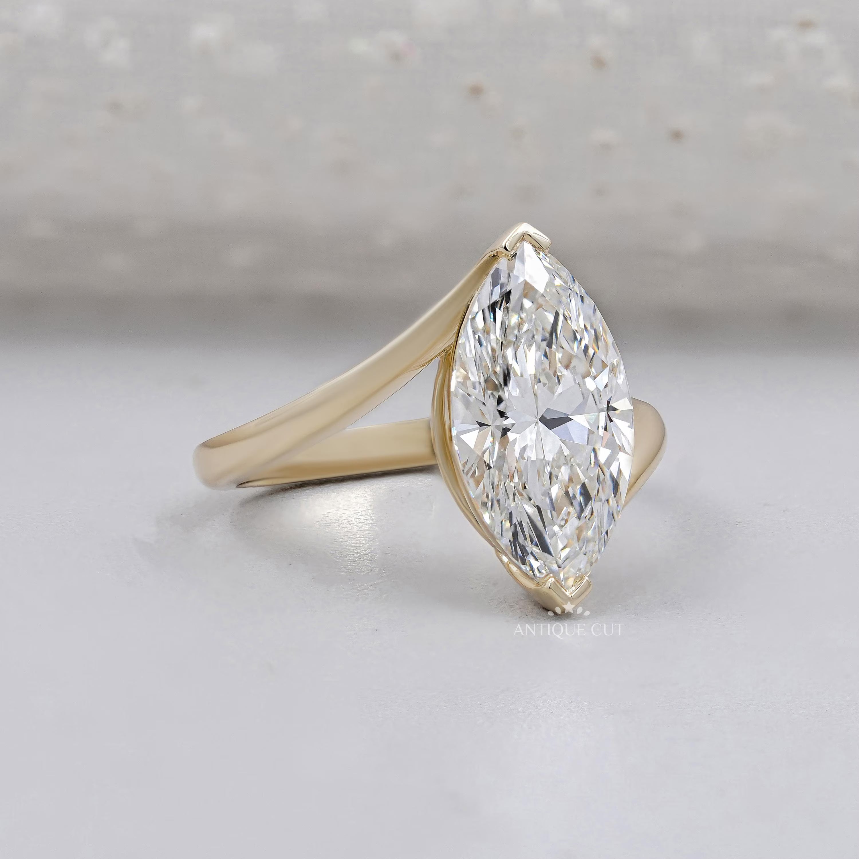 Marquise cut diamond bypass engagement ring with V prong setting