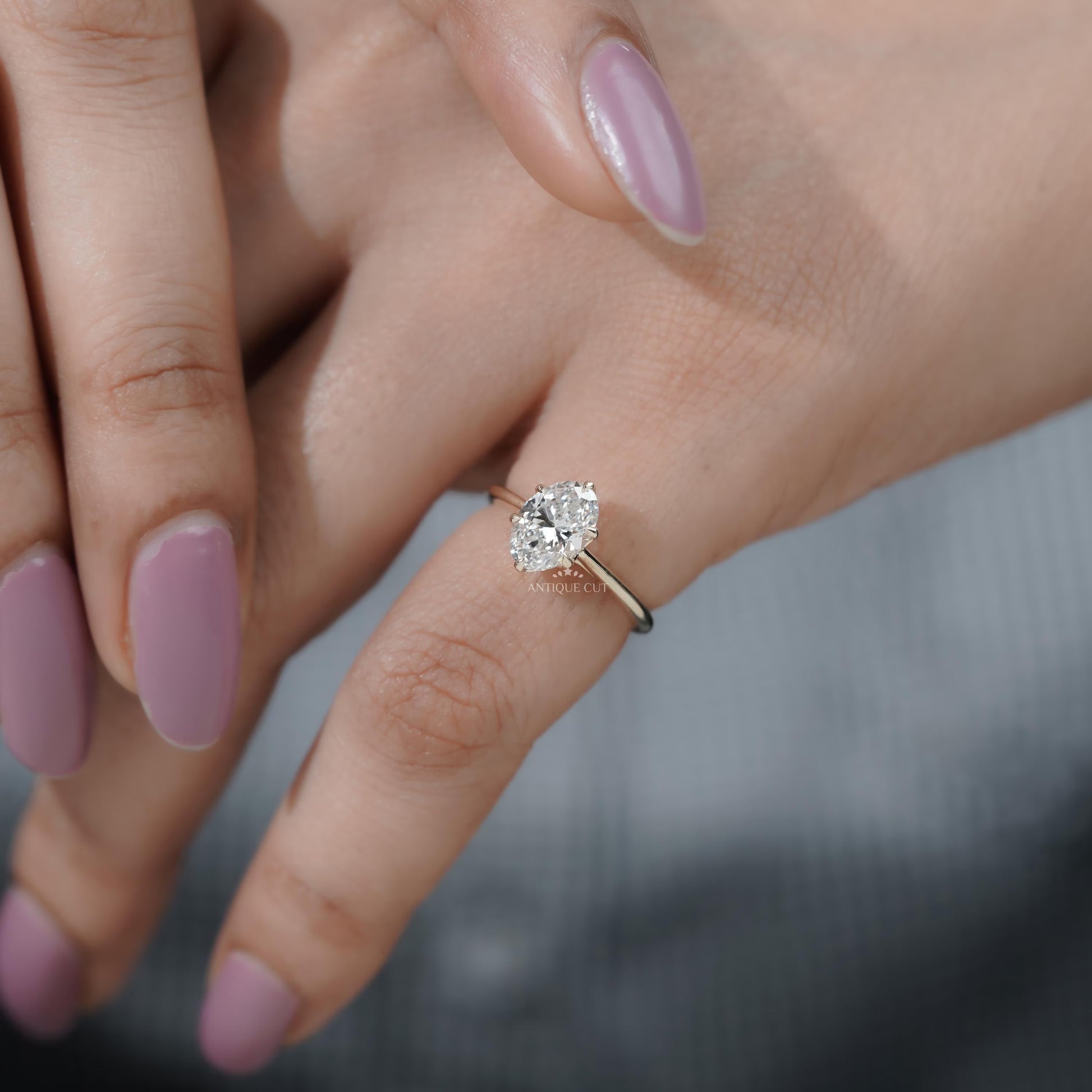 Minimalist oval solitaire engagement ring design