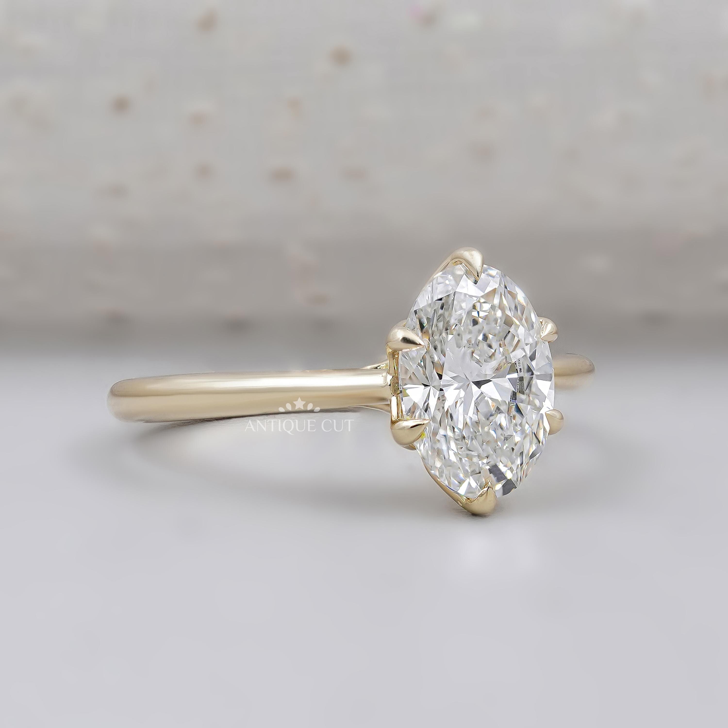 Oval cut lab grown diamond solitaire engagement ring with six prong setting