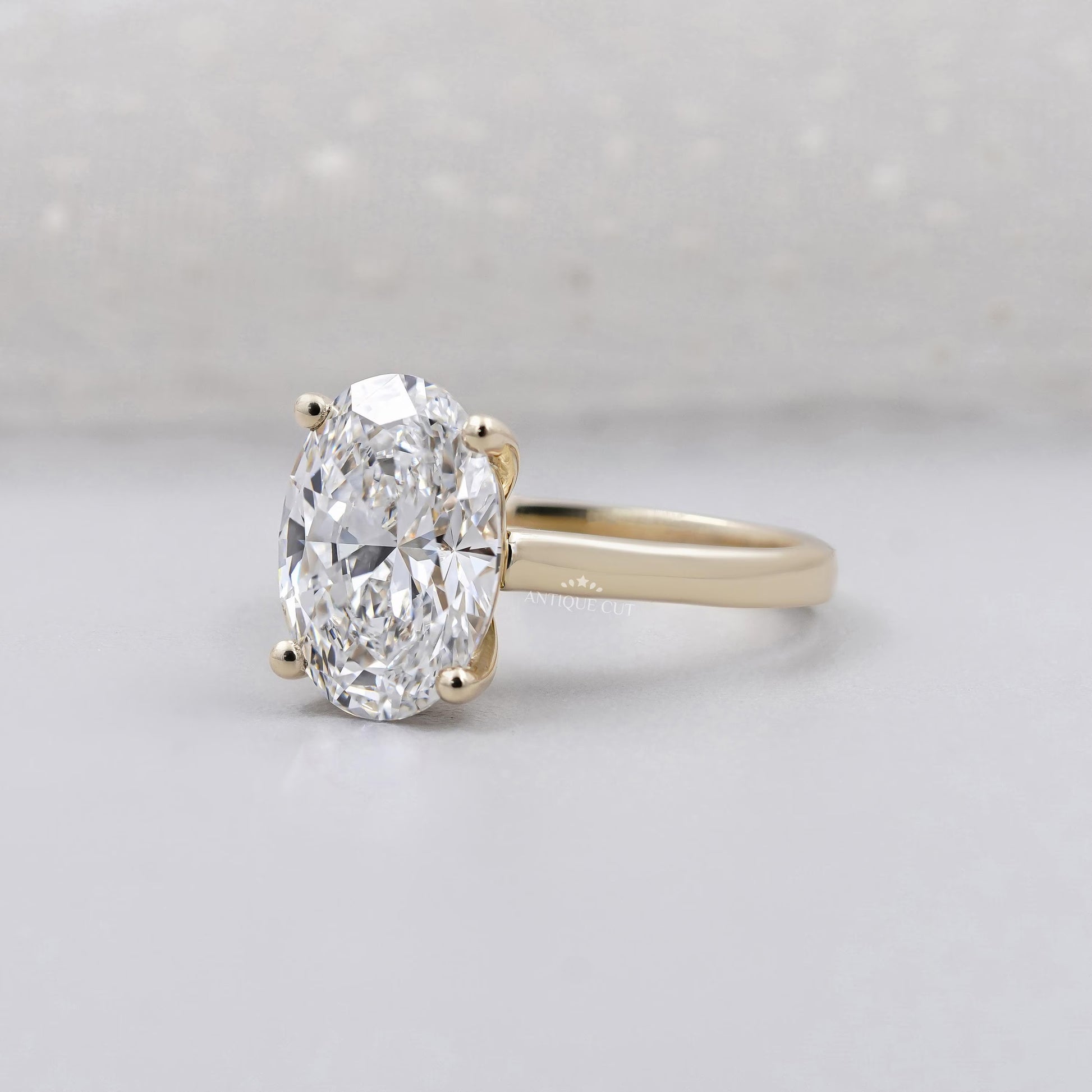 Yellow gold oval diamond engagement ring design