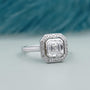 Asscher cut diamond bezel set halo engagement ring in white gold