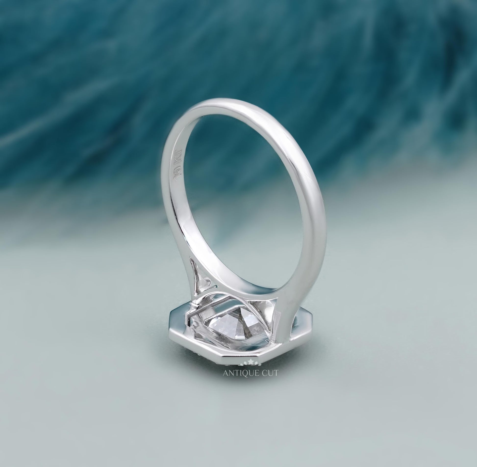 Elegant Asscher diamond engagement ring with halo design
