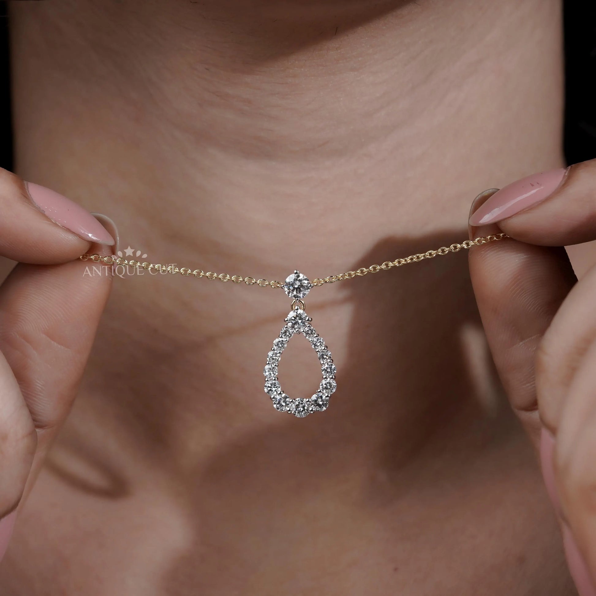 Modern teardrop pendant with diamond design