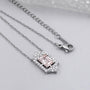 White gold round diamond halo pendant with blush pink emerald