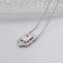 Blush pink emerald with round diamond halo pendant white gold
