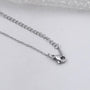 Antiquecut blush pink emerald round diamond halo pendant