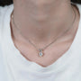 White and yellow gold solitaire diamond pendant