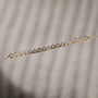 Sleek yellow gold diamond bar pendant
