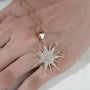 Modern sunburst pendant with round diamond
