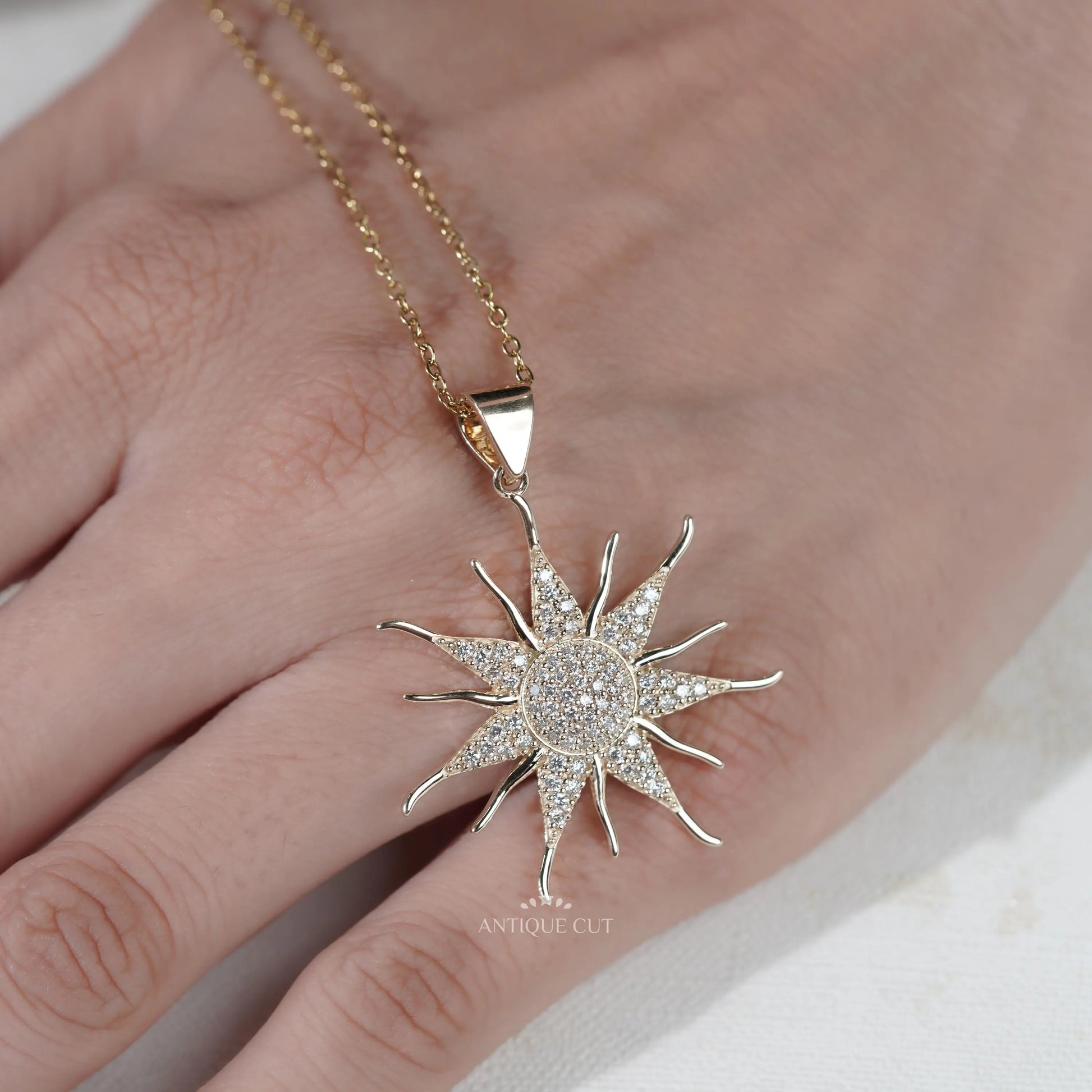 Modern sunburst pendant with round diamond