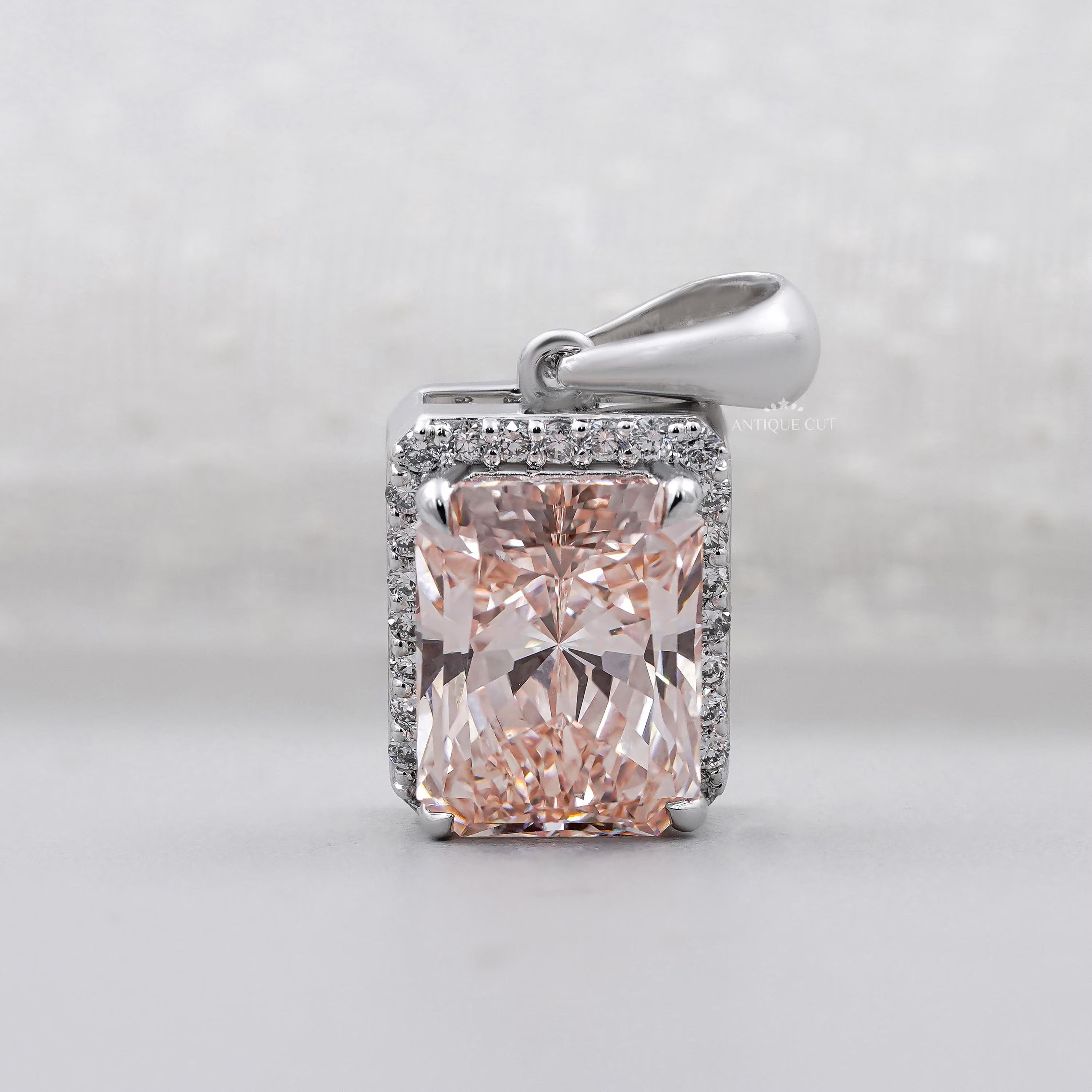 Pink diamond radiant cut halo pendant in white gold