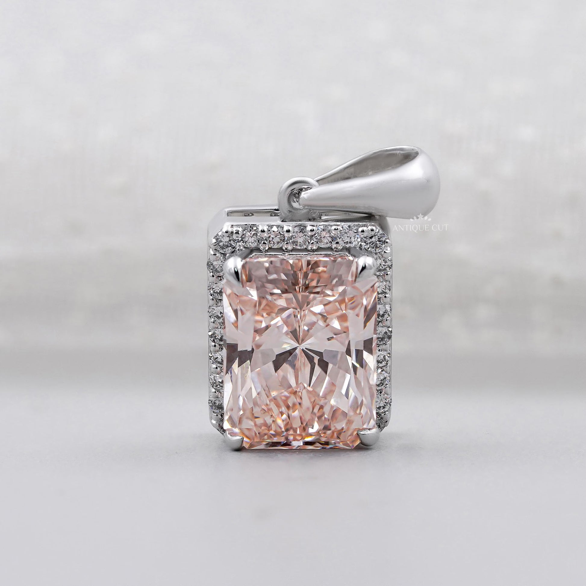 Pink diamond radiant cut halo pendant in white gold