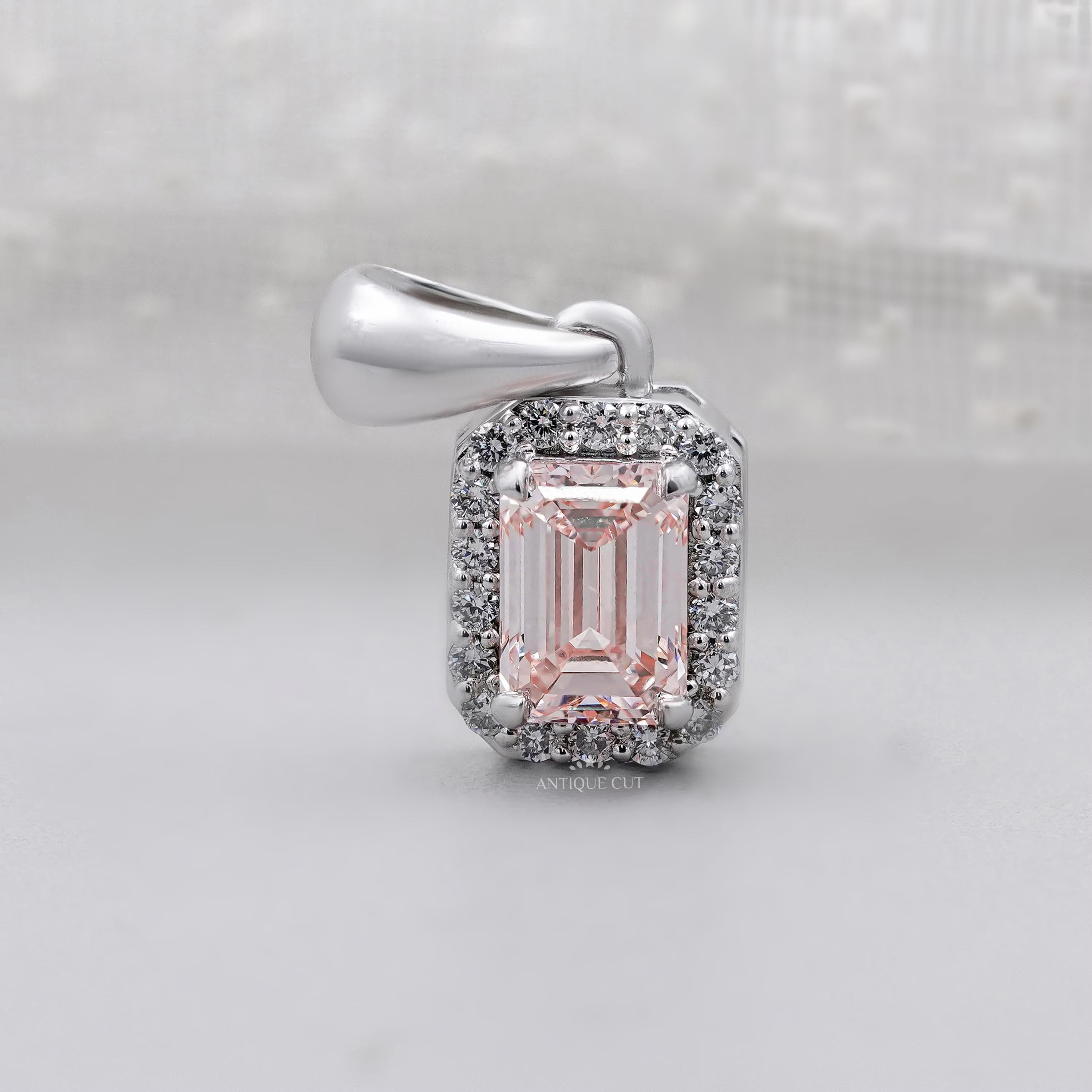 Classic emerald cut halo diamond pendant in white gold
