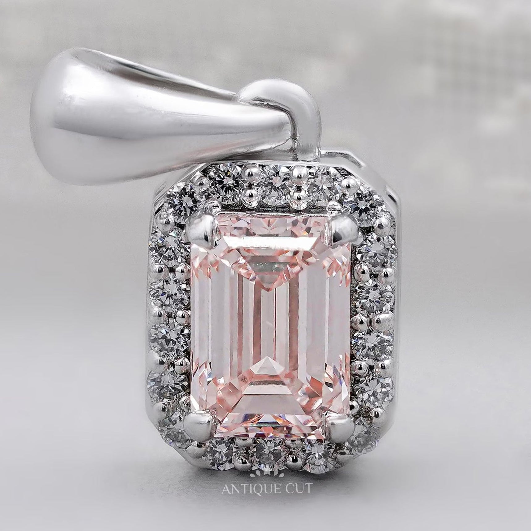 Classic emerald cut halo diamond pendant with IGI certification