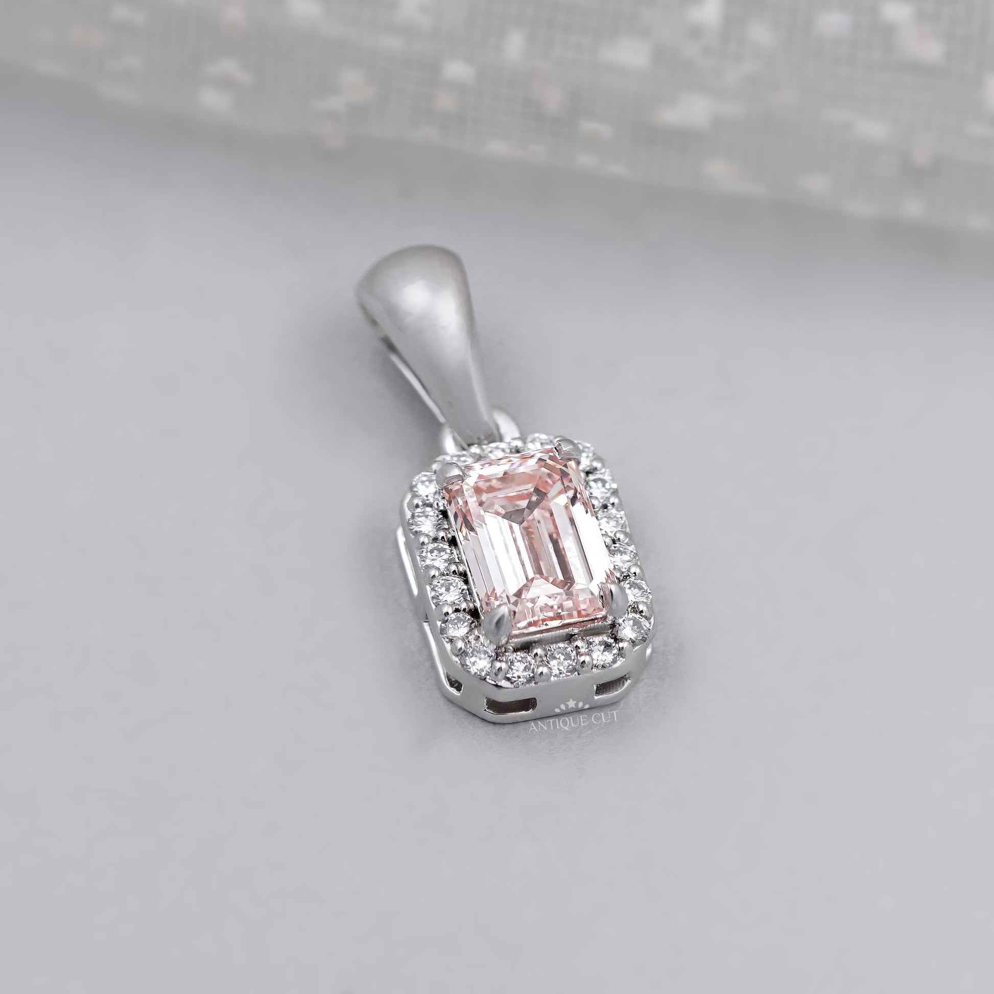 Antiquecut emerald cut halo pendant