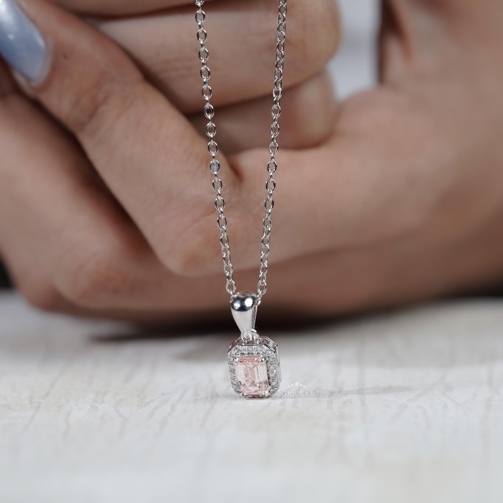 Elegant emerald cut halo pendant necklace