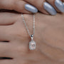 Modern emerald cut halo pendant white gold