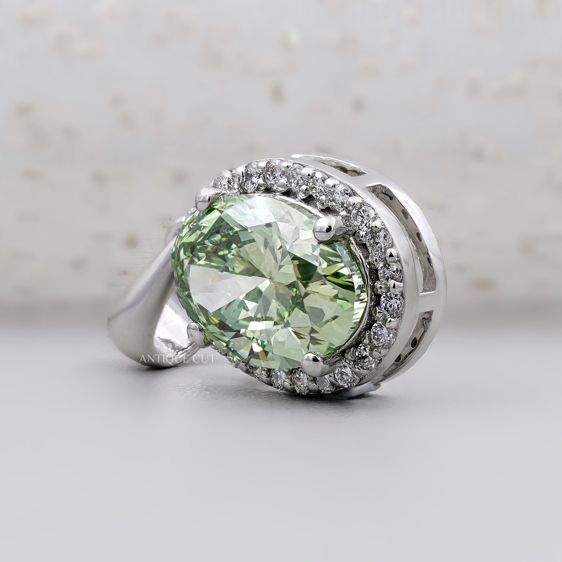 Antiquecut oval green diamond pendant