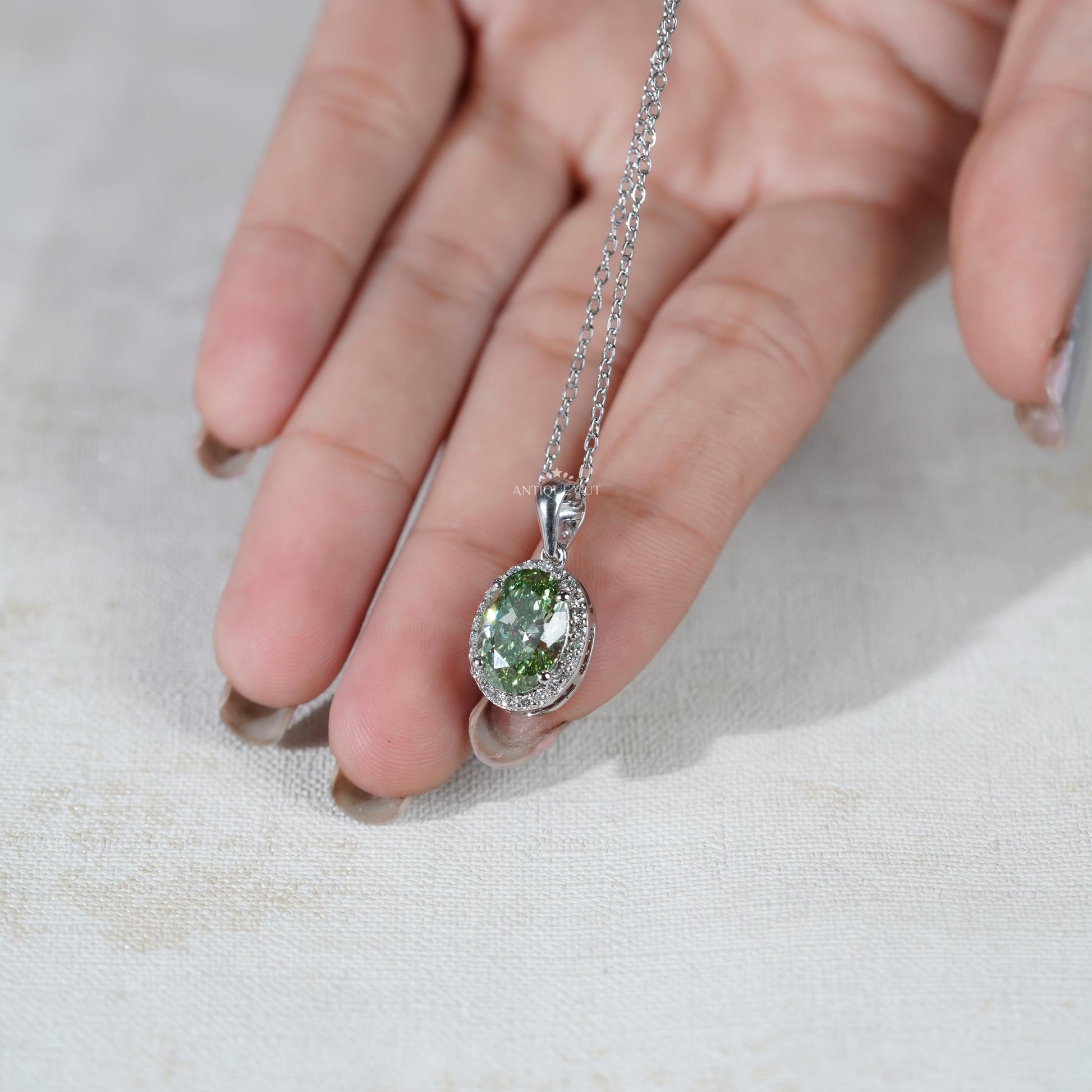 Sophisticated oval green diamond pendant