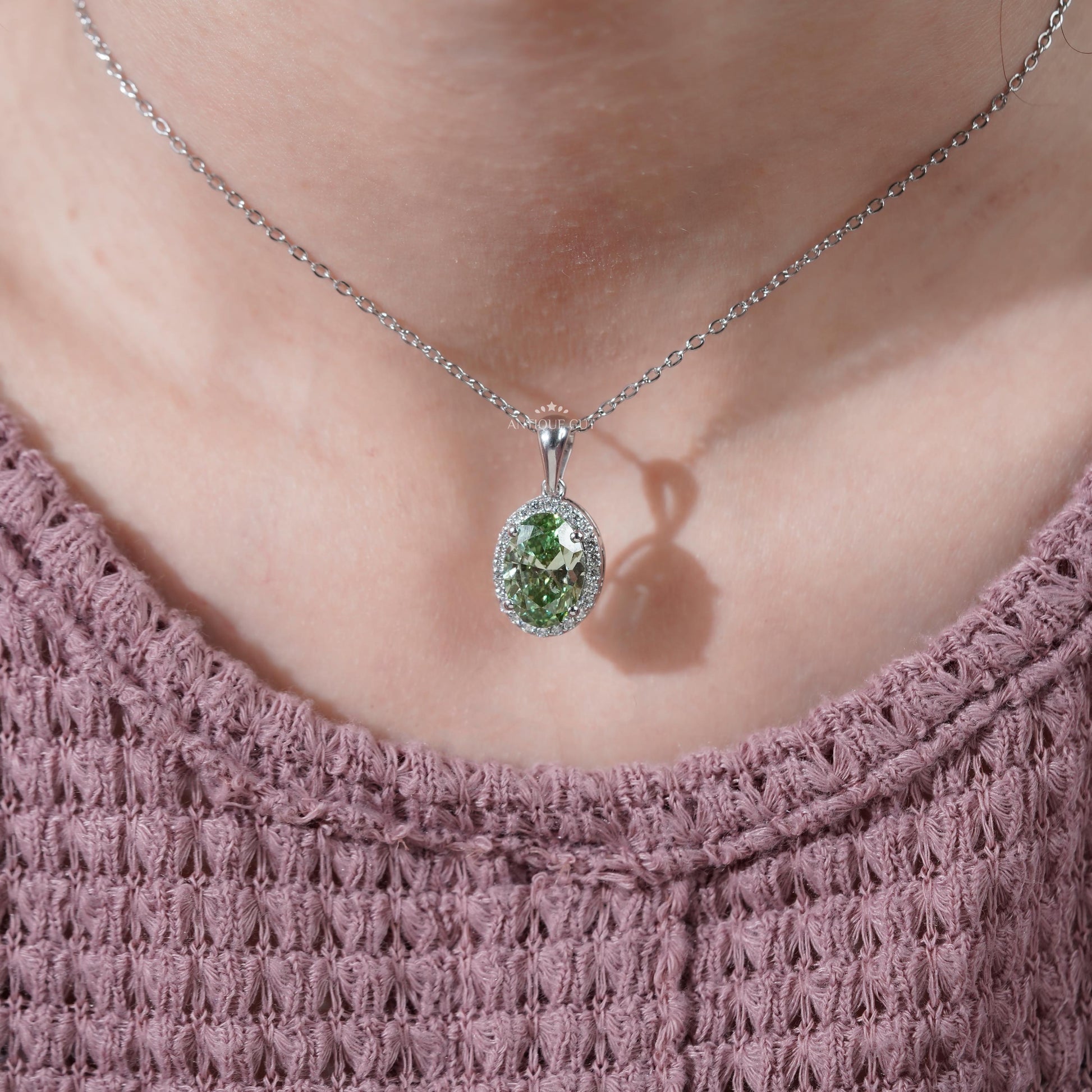 Oval cut green diamond pendant white gold
