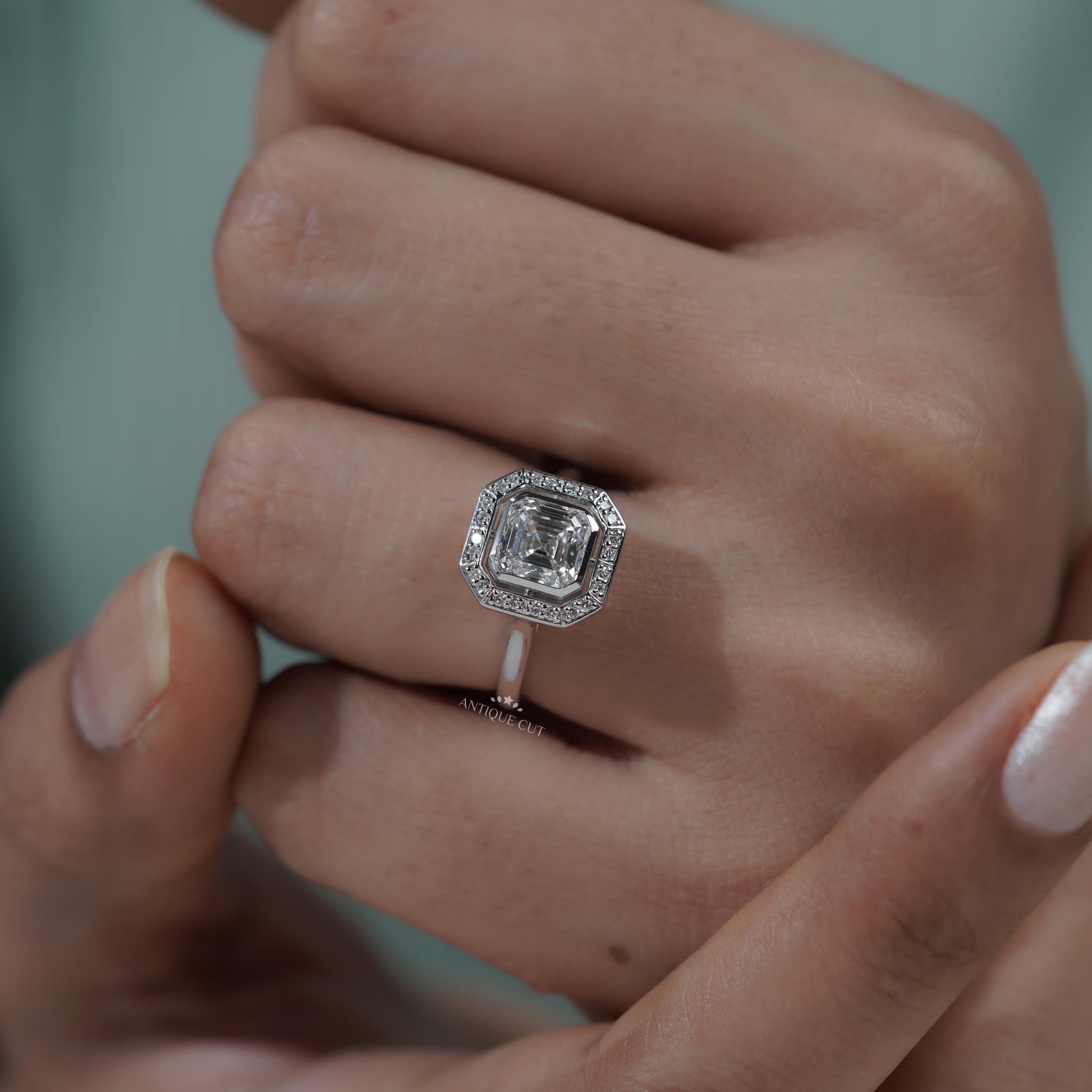 Unique bezel halo diamond engagement ring design