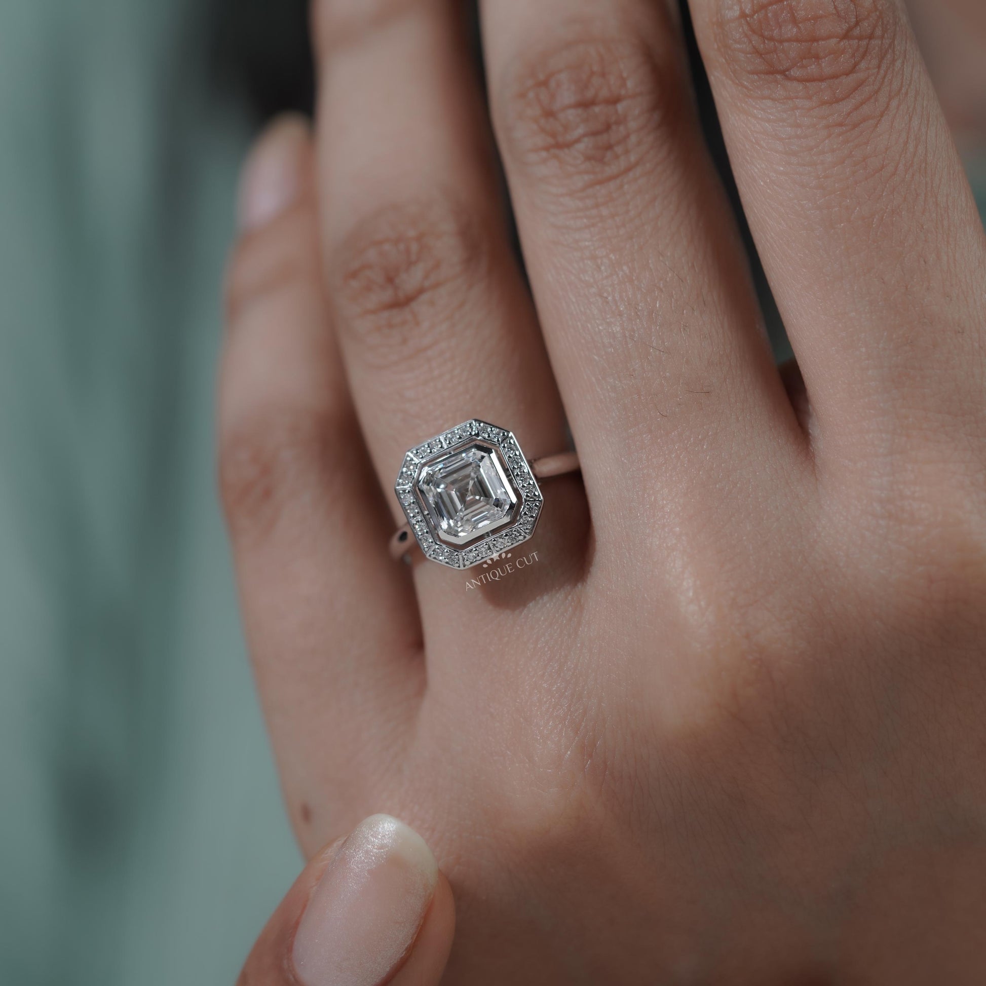 Classic square Asscher diamond ring with bezel setting