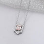 Lab grown diamond round halo pendant with blush pink emerald