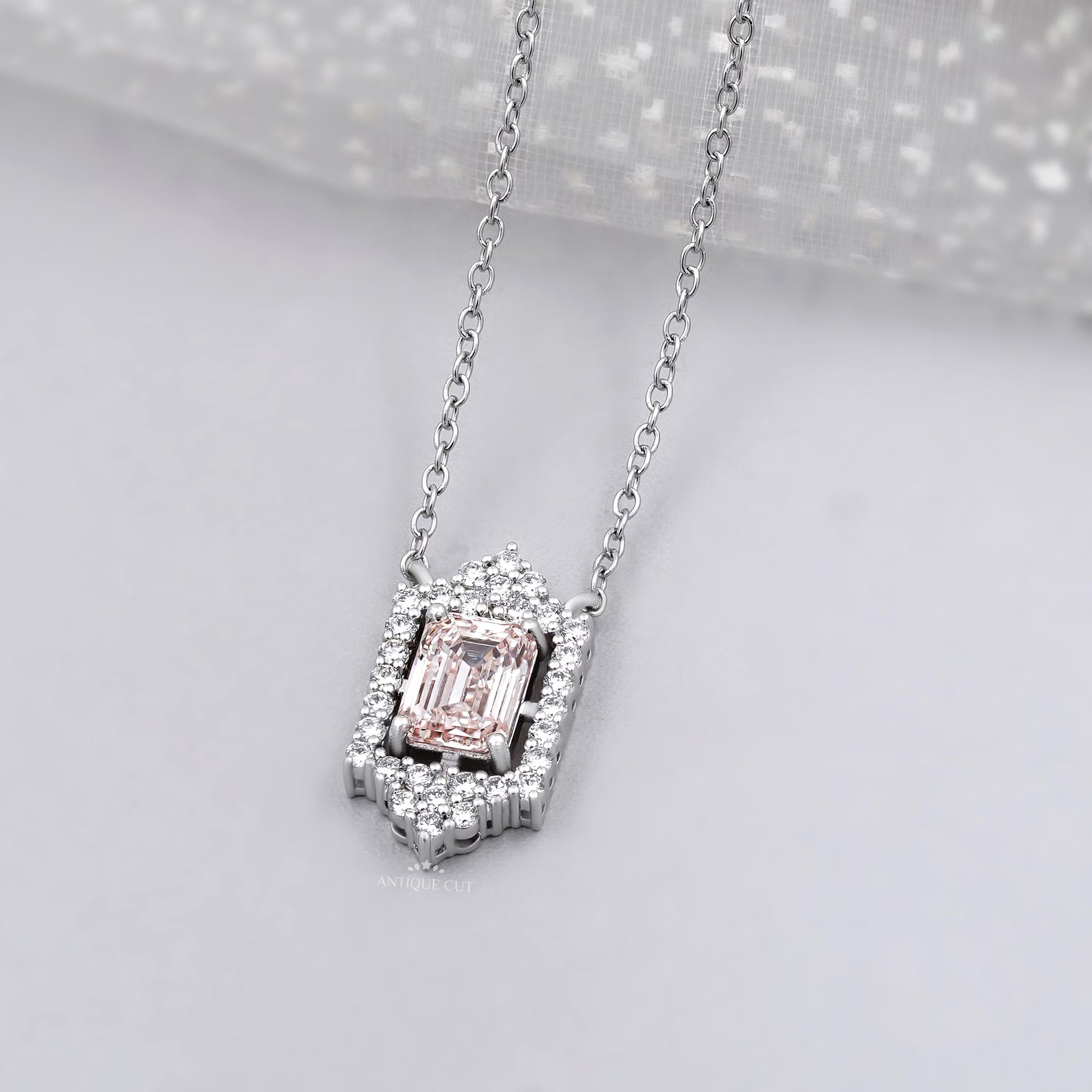 Lab grown diamond round halo pendant with blush pink emerald