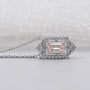 IGI certified round diamond halo pendant with emerald