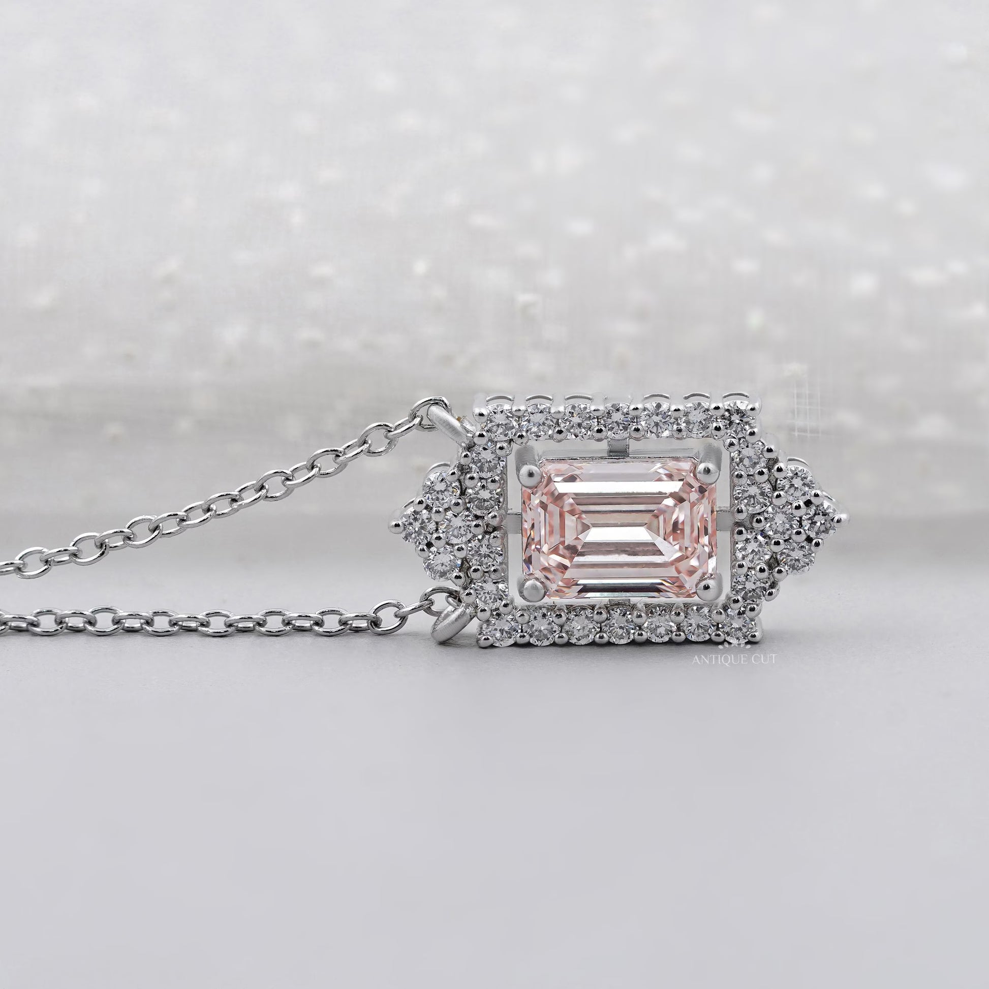 IGI certified round diamond halo pendant with emerald